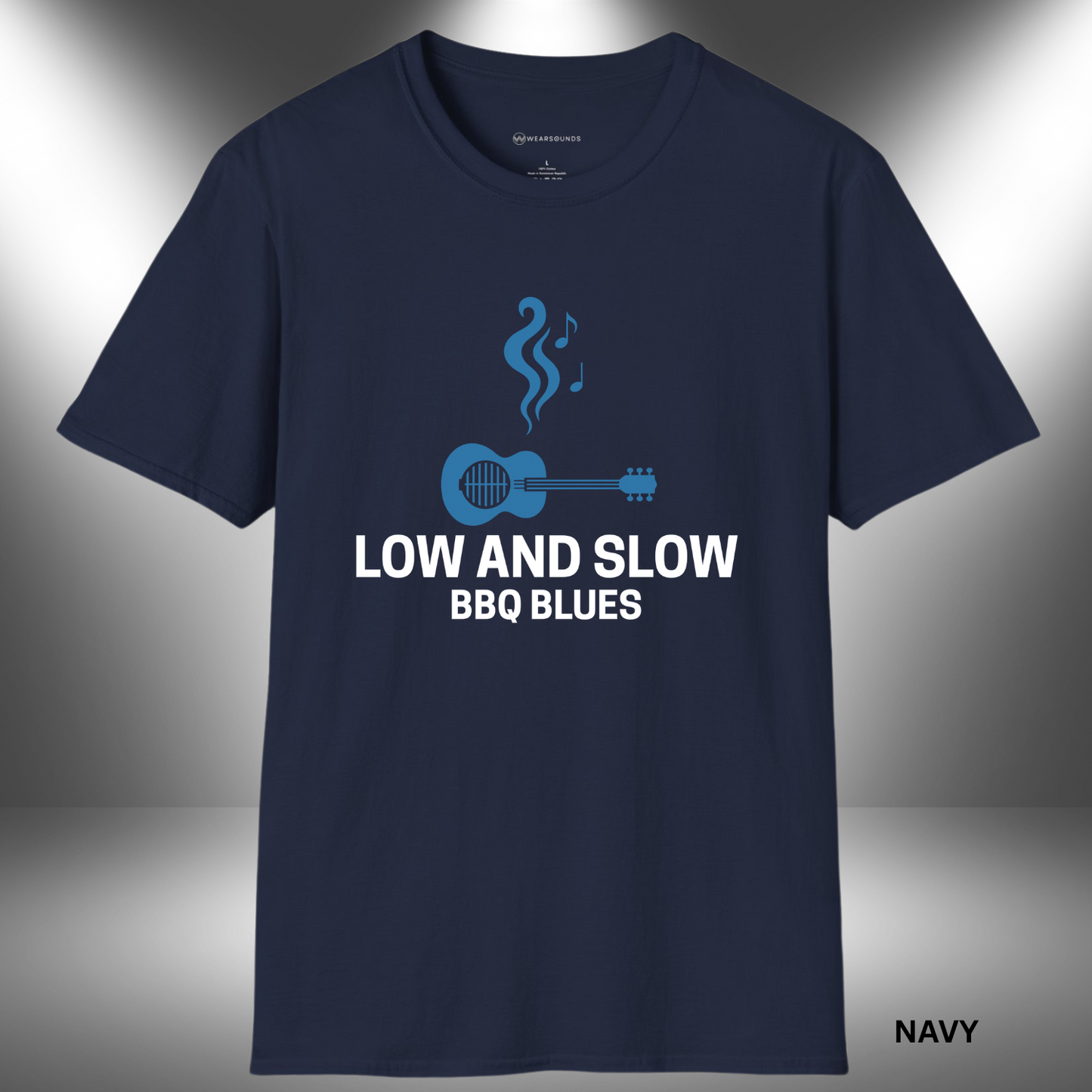 Stylized graphic of a blue acoustic guitar with grill grates over the sound hole, rising smoke shaped like music notes above it. The text “LOW AND SLOW BBQ BLUES” appears below in bold white lettering on a black background.