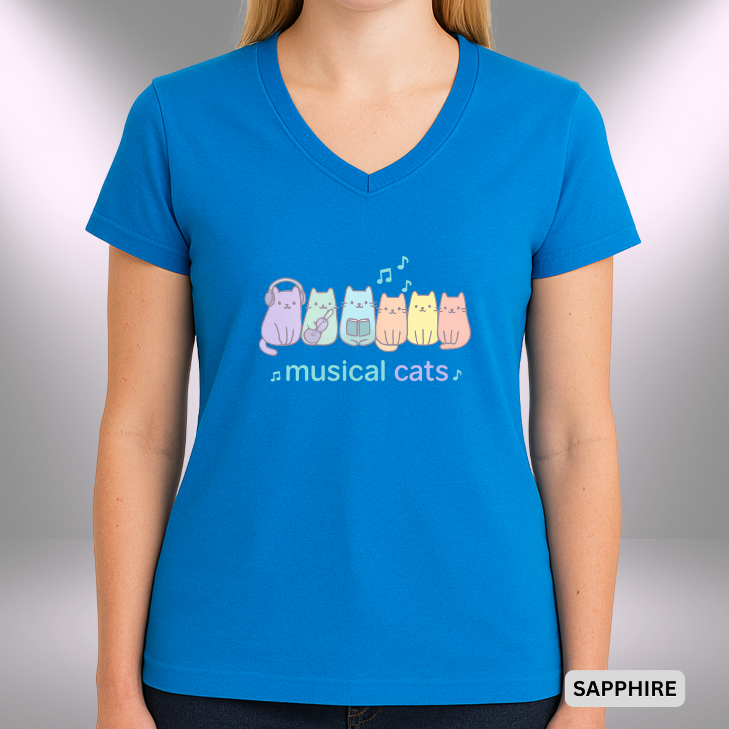 Cartoon-style design with six pastel-colored cats, each with a musical theme — one with headphones, one playing ukulele, one holding a book — with music notes floating above. The phrase “musical cats” is written in lowercase in aqua and lavender.