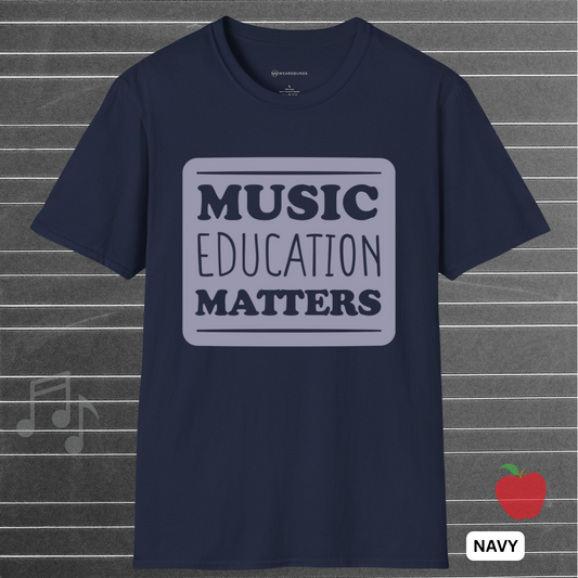 Navy blue t-shirt with 'Music Education Matters' text on a gray background with musical notes and an apple icon.