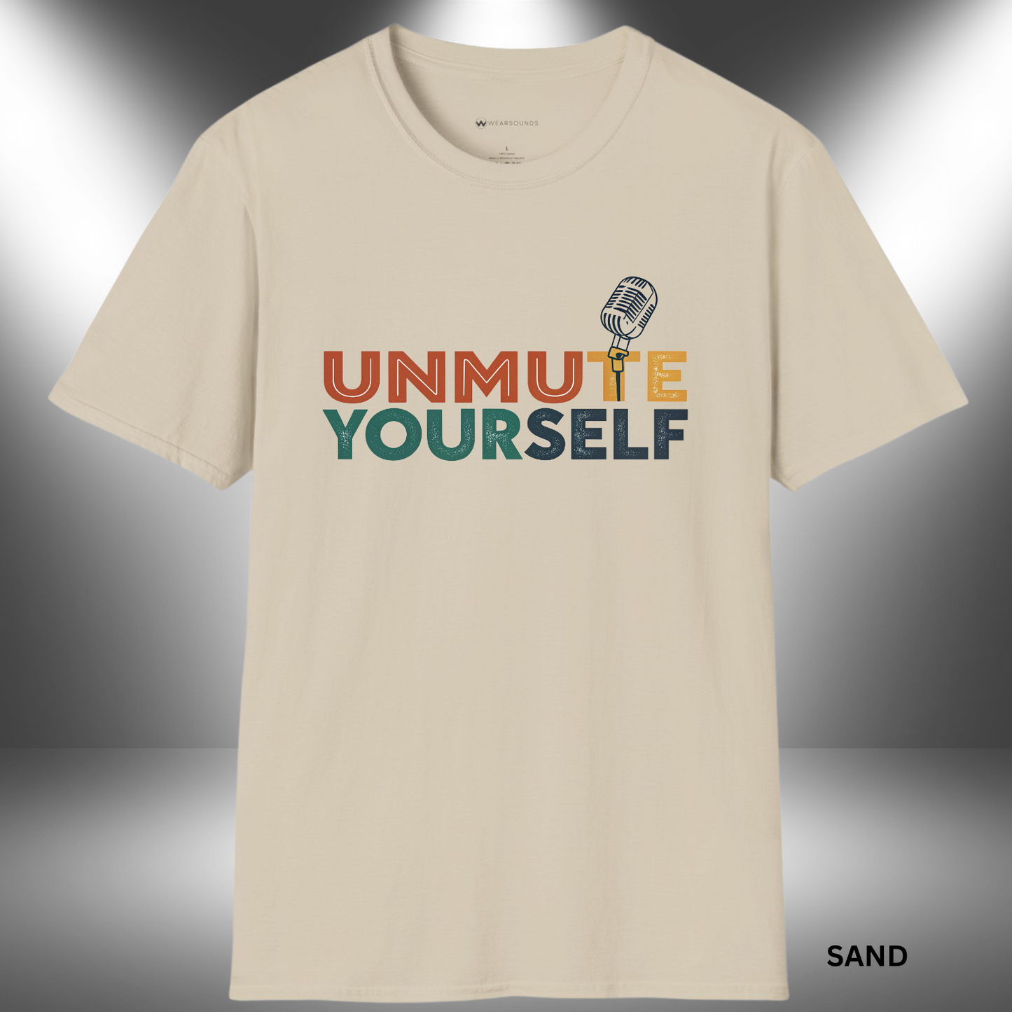 Graphic t-shirt design with the words “Unmute Yourself” in a mix of warm and cool distressed block letters. The “T” in “Unmute” is a retro microphone illustration.