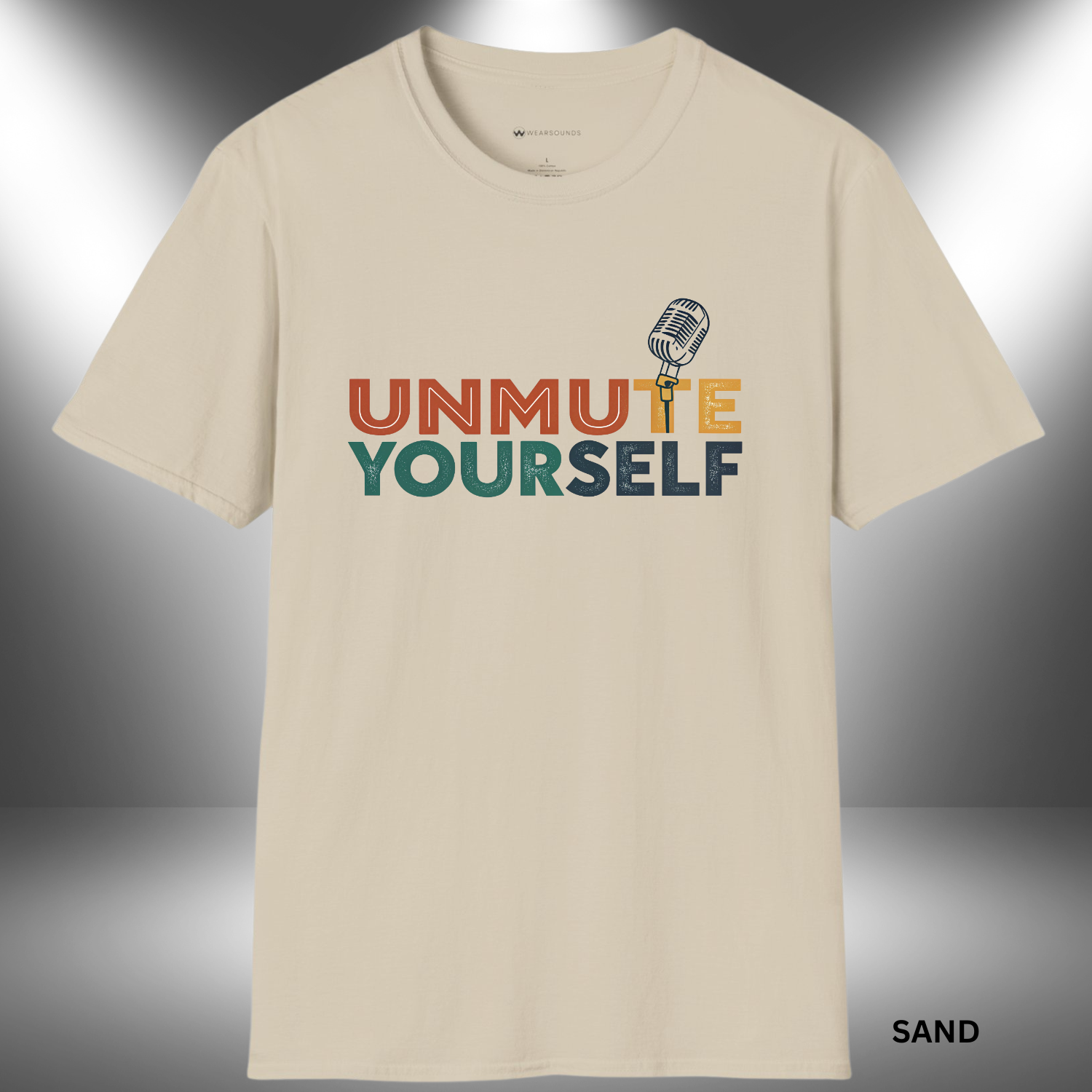 Graphic t-shirt design with the words “Unmute Yourself” in a mix of warm and cool distressed block letters. The “T” in “Unmute” is a retro microphone illustration.